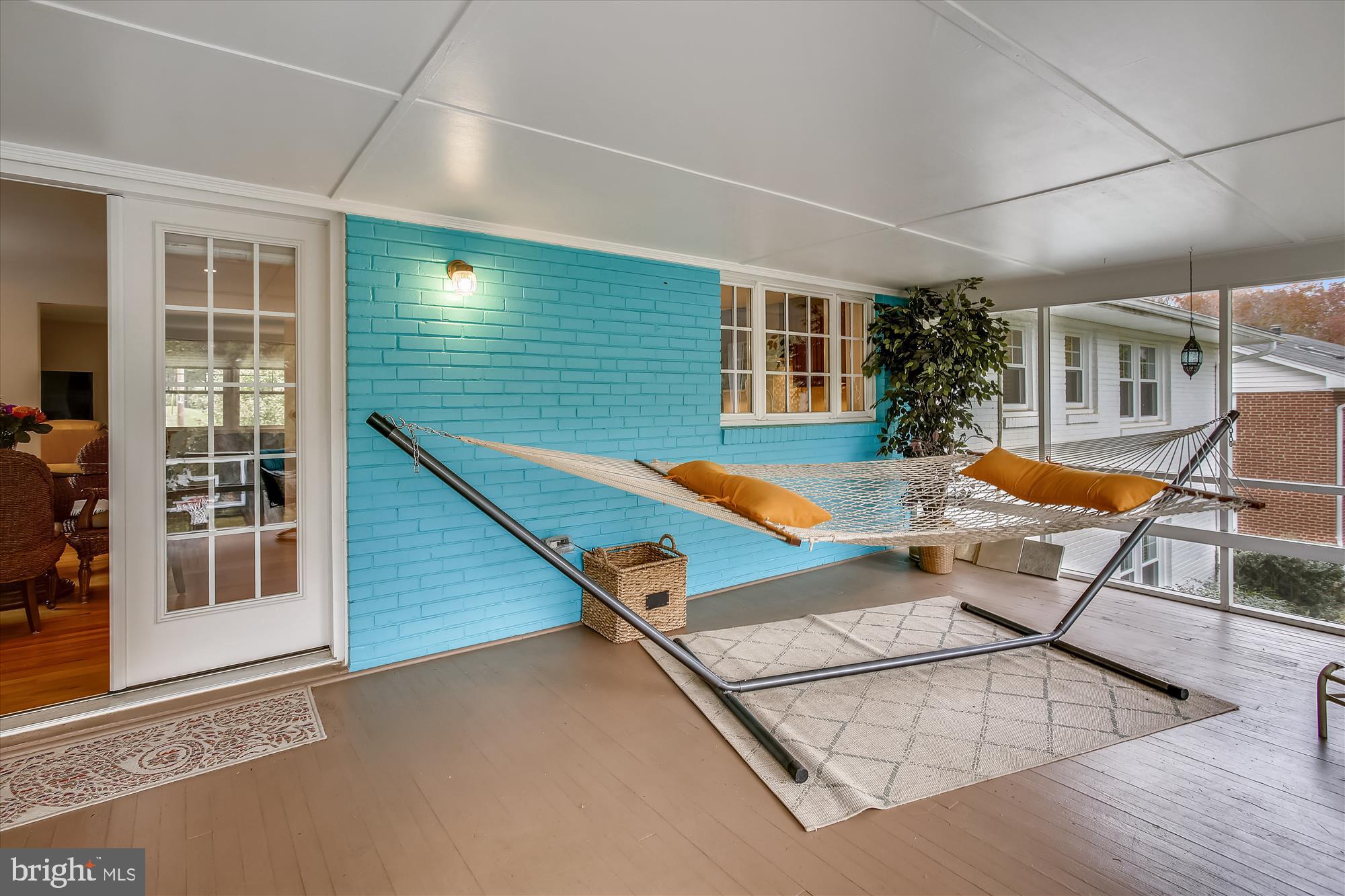 1437 Cola Drive McLean, VA 22101 - Photo 9 of 34 an outdoor sitting area with furniture and wooden floor
