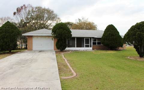 208 Mirador Drive Sebring, FL 33876 - Photo 1 of 17 a view of a house with pool and chairs