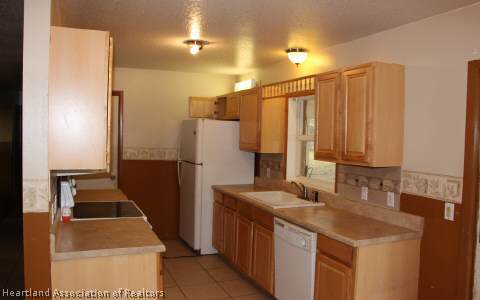 208 Mirador Drive Sebring, FL 33876 - Photo 3 of 17 a bathroom with a sink a toilet and a mirror