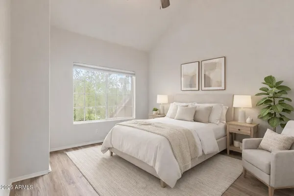 a bedroom with a bed and a couch