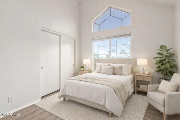 a bedroom with a bed and a window
