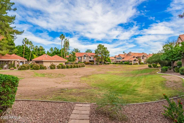 a view of a swimming pool with an outdoor seating