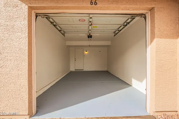 a view of a hallway with a ceiling fan