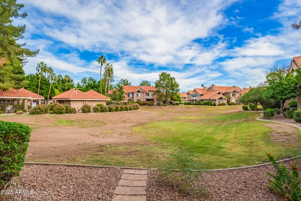 a view of a swimming pool with an outdoor seating