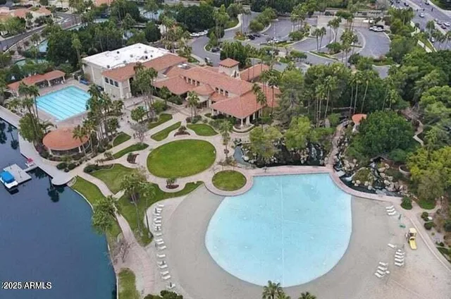 an aerial view of a swimming pool and outdoor space