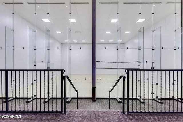 a view of hallway with wooden floor