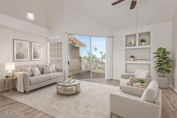 a living room with furniture and a large window