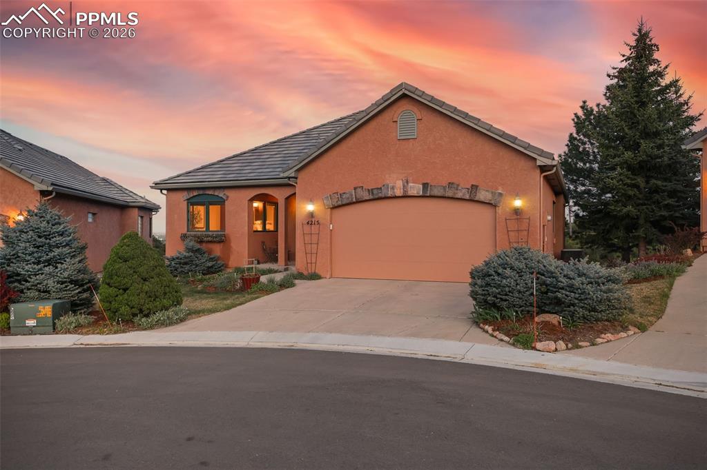 4215 Star Ranch Road Colorado Springs, CO 80906 - Photo 33 of 44 a front view of a house with a yard and garage