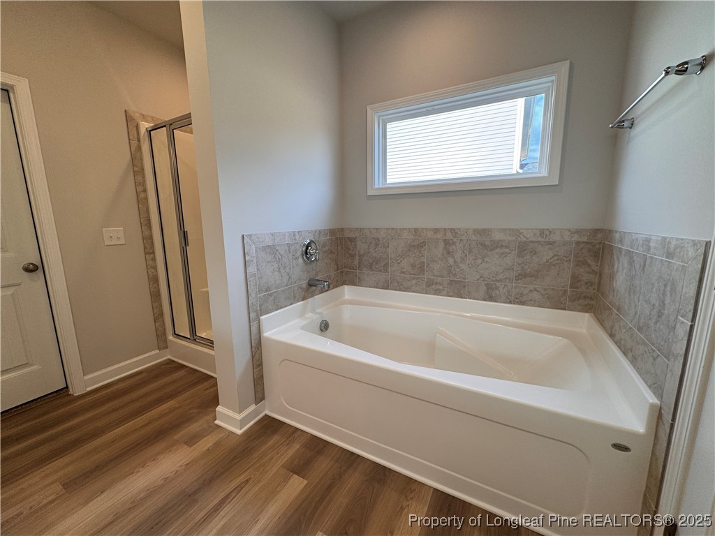 294 Elijah Way Vass, NC 28394 - Photo 17 of 33 a bathroom with a bathtub