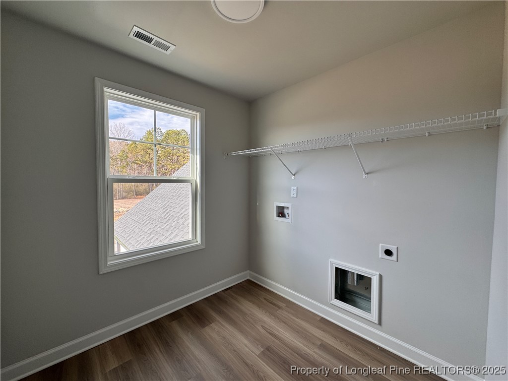 294 Elijah Way Vass, NC 28394 - Photo 27 of 33 a view of empty room with window and fireplace