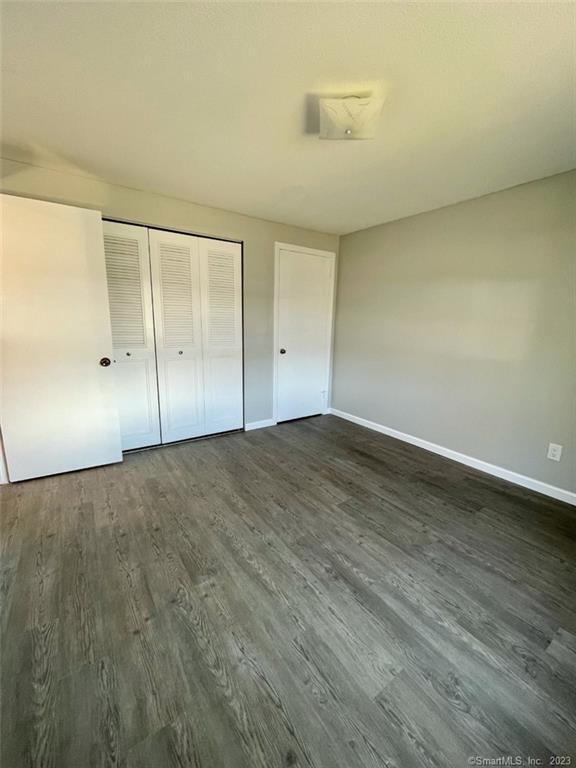 114 South Washington Street, Unit 24 Plainville, CT 06062 - Photo 9 of 14 wooden floor in an empty room