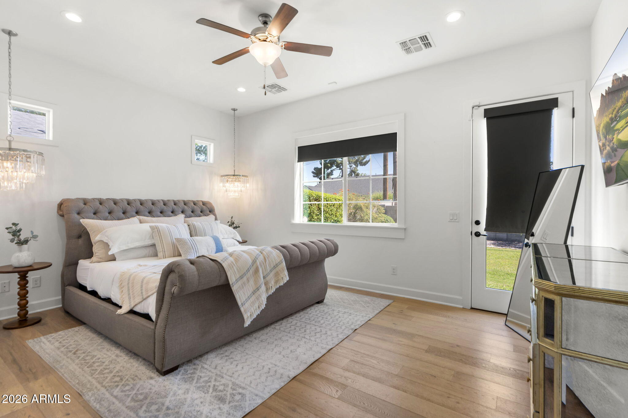 4201 East Cheery Lynn Road Phoenix, AZ 85018 - Photo 11 of 31 a bedroom with a bed flat screen tv and window