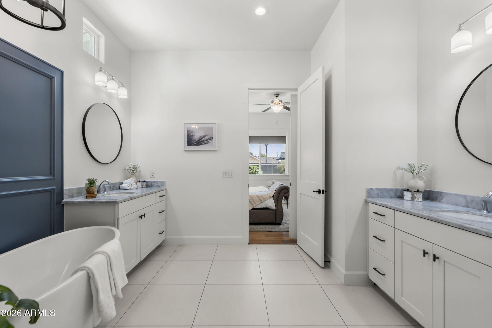 4201 East Cheery Lynn Road Phoenix, AZ 85018 - Photo 14 of 31 a spacious bathroom with a double vanity sink mirror and toilet
