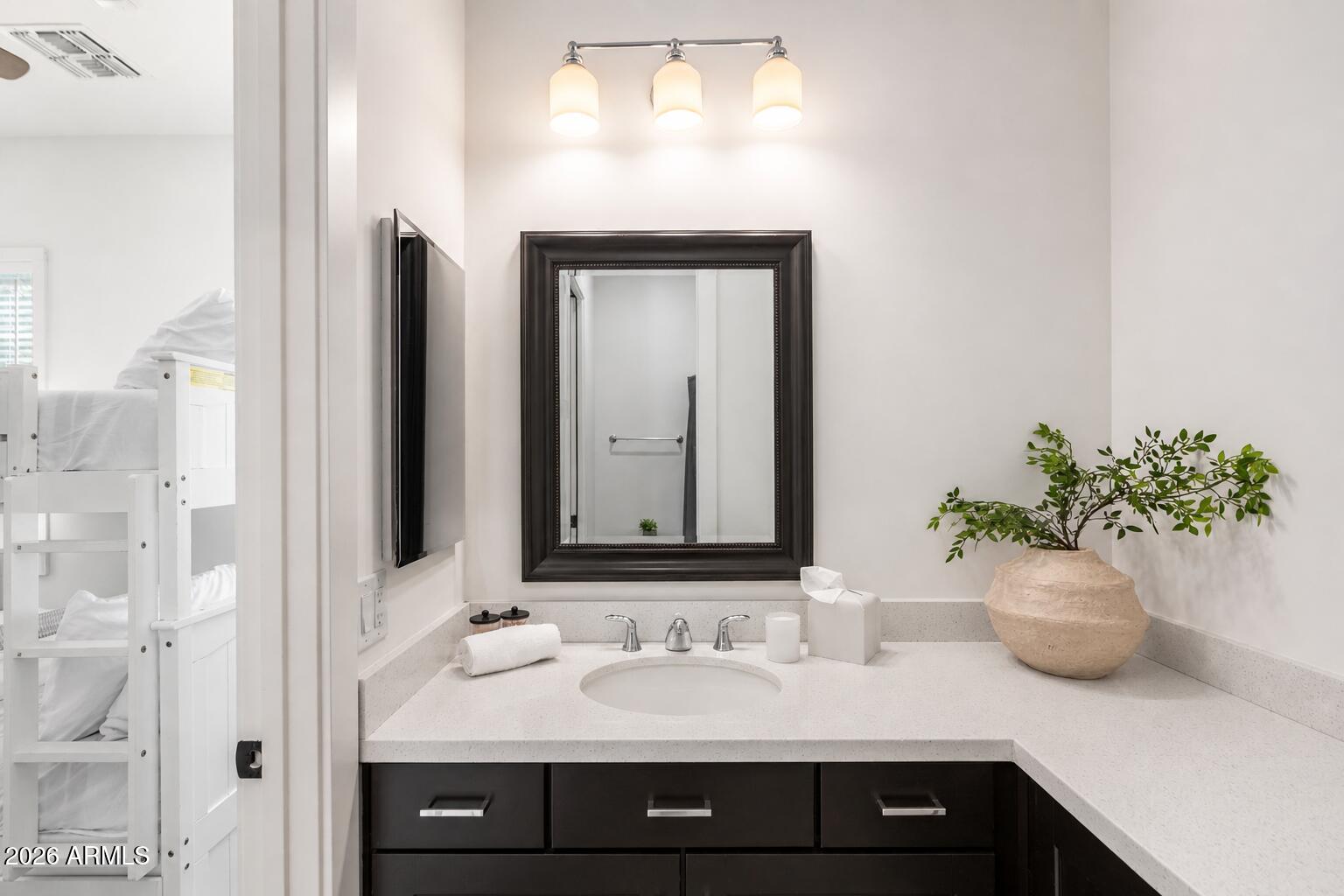 4201 East Cheery Lynn Road Phoenix, AZ 85018 - Photo 20 of 31 a bathroom with a sink and a mirror