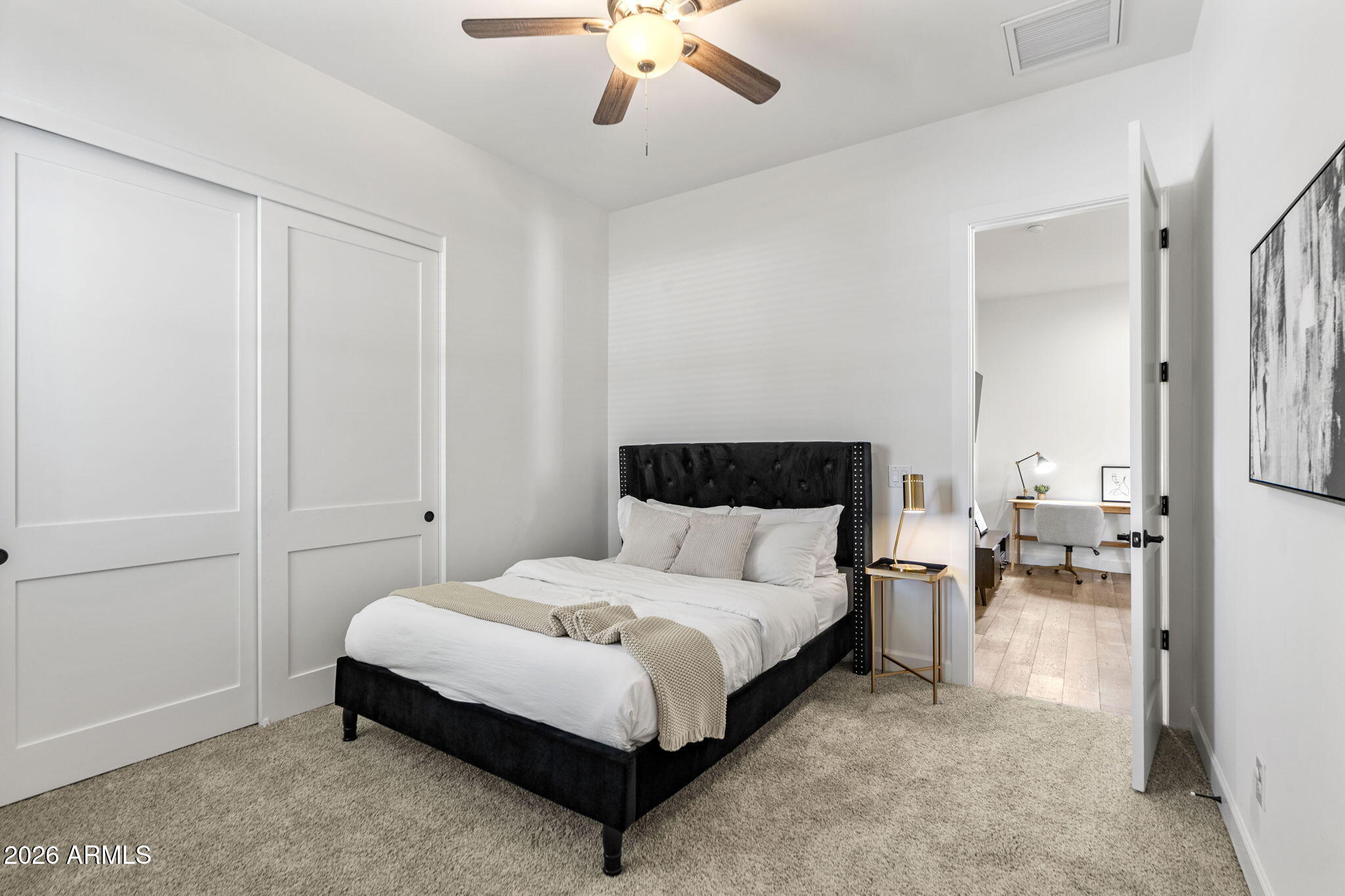 4201 East Cheery Lynn Road Phoenix, AZ 85018 - Photo 22 of 31 a bedroom with bed and a chandelier
