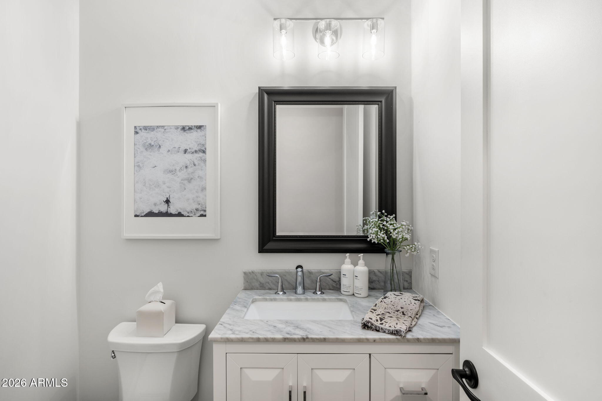 4201 East Cheery Lynn Road Phoenix, AZ 85018 - Photo 23 of 31 a bathroom with a toilet sink and mirror