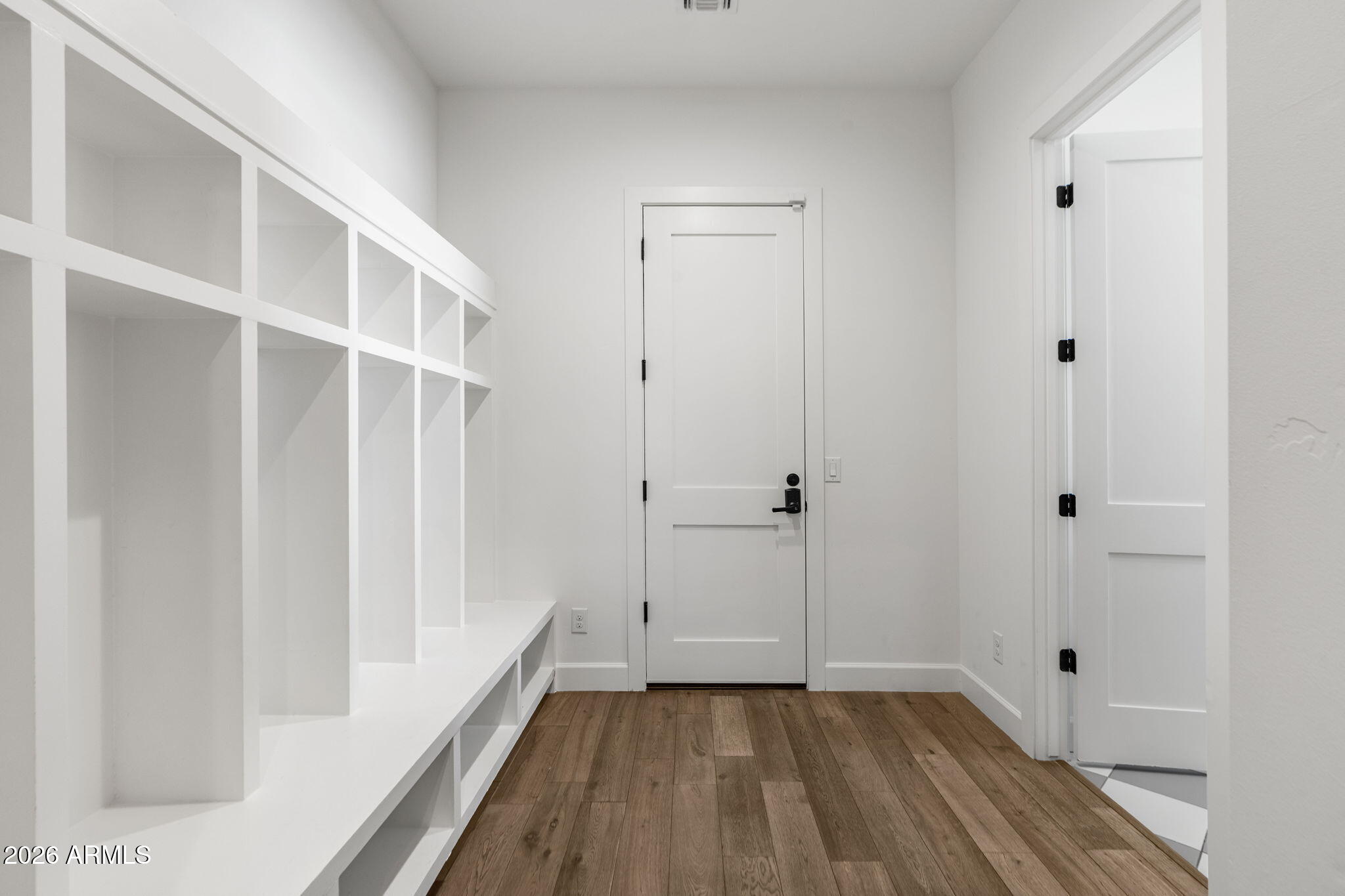4201 East Cheery Lynn Road Phoenix, AZ 85018 - Photo 24 of 31 a view of a hallway with wooden floor and closet