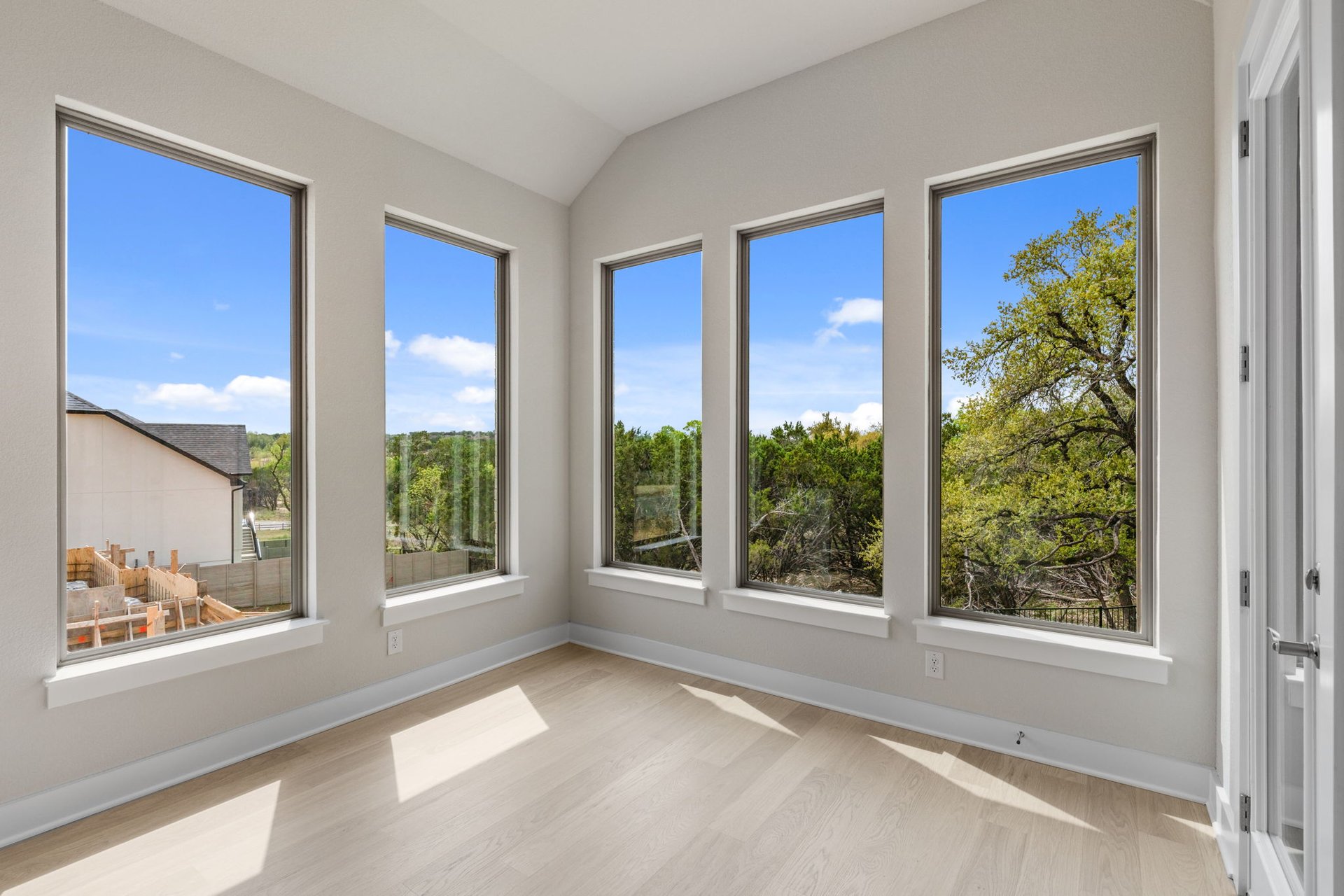 1908 Crimson Sunset Drive Georgetown, TX 78628 - Photo 14 of 40 a view of a room with a large window and wooden floor