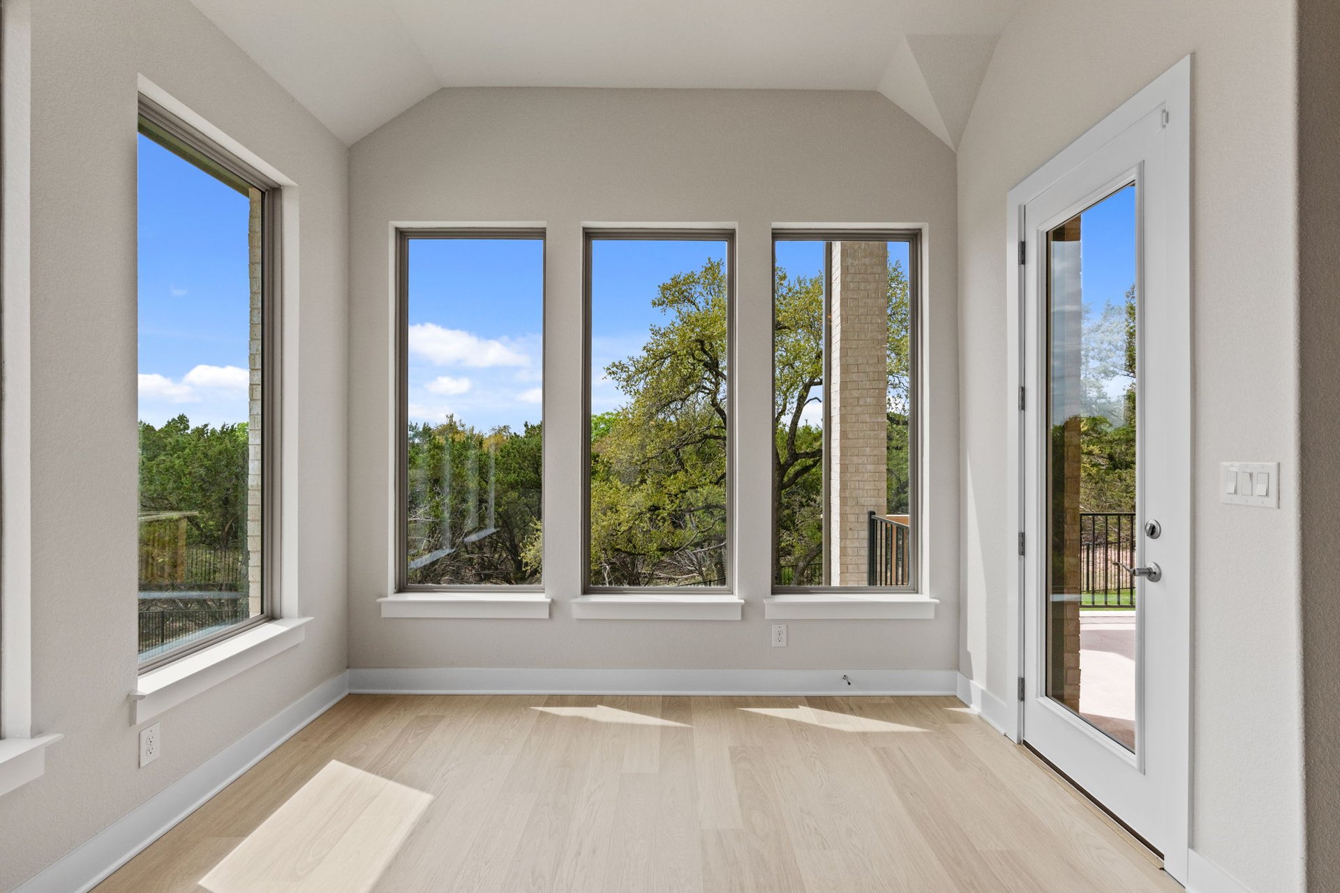 1908 Crimson Sunset Drive Georgetown, TX 78628 - Photo 15 of 40 a view of an empty room with large windows