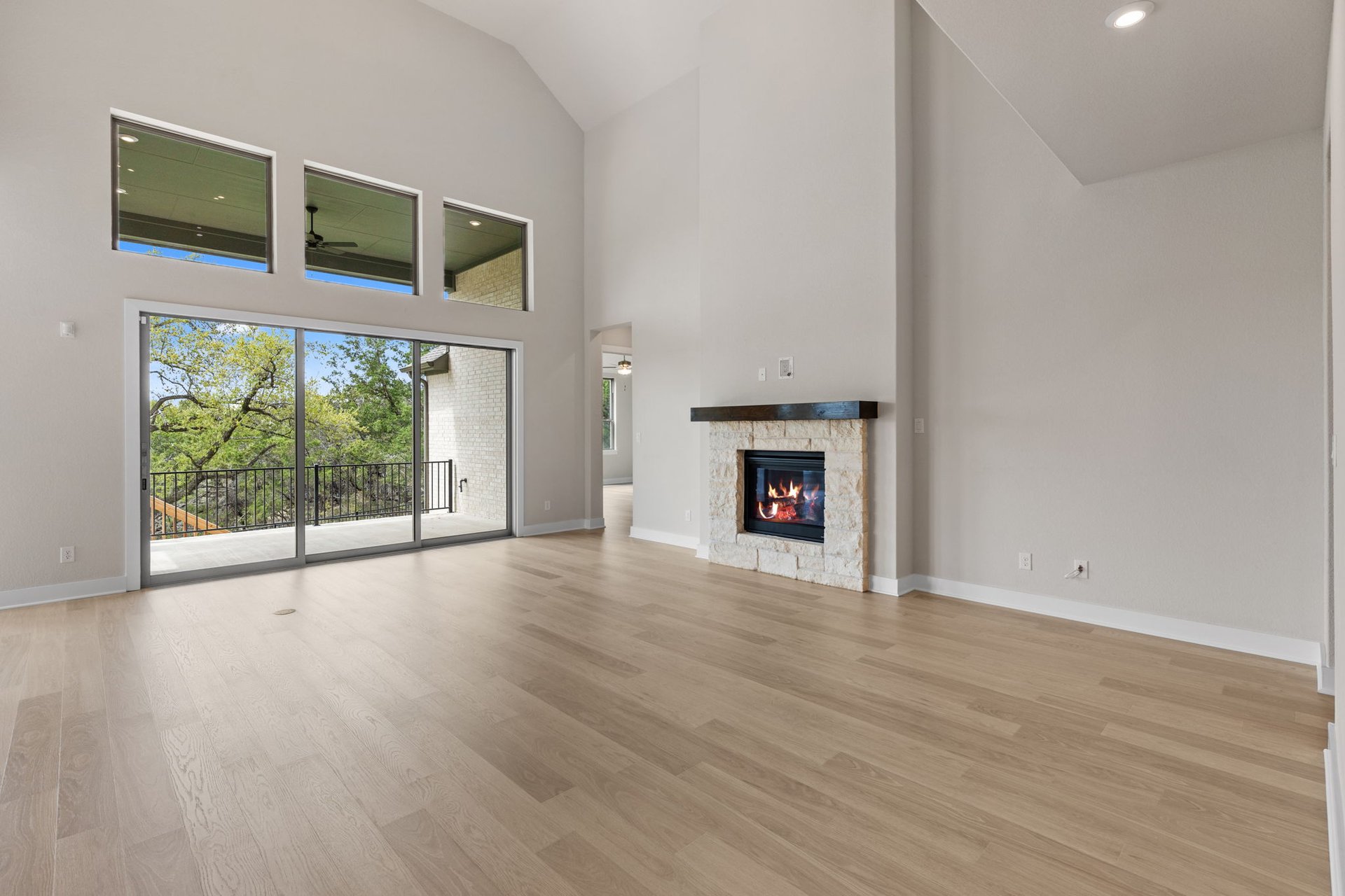 1908 Crimson Sunset Drive Georgetown, TX 78628 - Photo 18 of 40 a view of empty room with wooden floor and fireplace