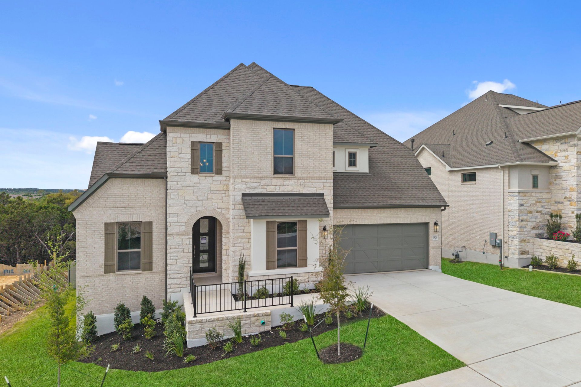 1908 Crimson Sunset Drive Georgetown, TX 78628 - Photo 2 of 40 a front view of a house with garden