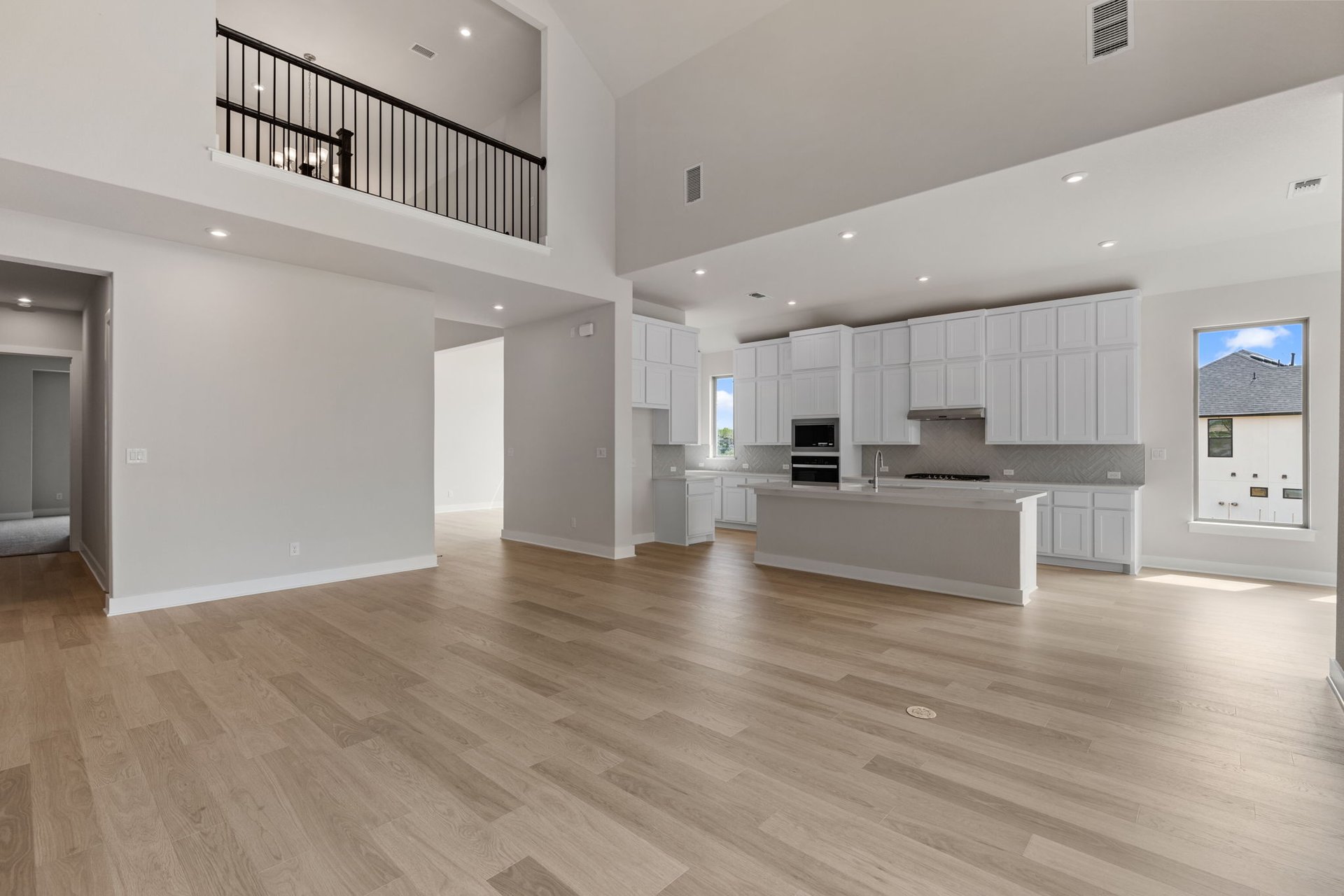 1908 Crimson Sunset Drive Georgetown, TX 78628 - Photo 21 of 40 a view of kitchen with kitchen island wooden floor center island and stainless steel appliances
