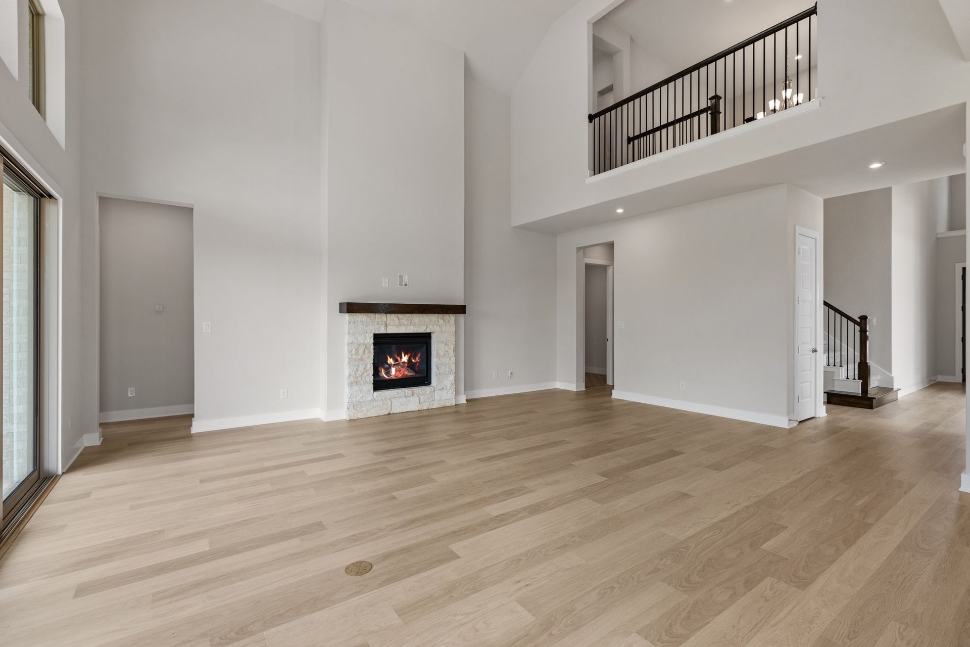 1908 Crimson Sunset Drive Georgetown, TX 78628 - Photo 22 of 40 a view of an empty room with wooden floor and a window