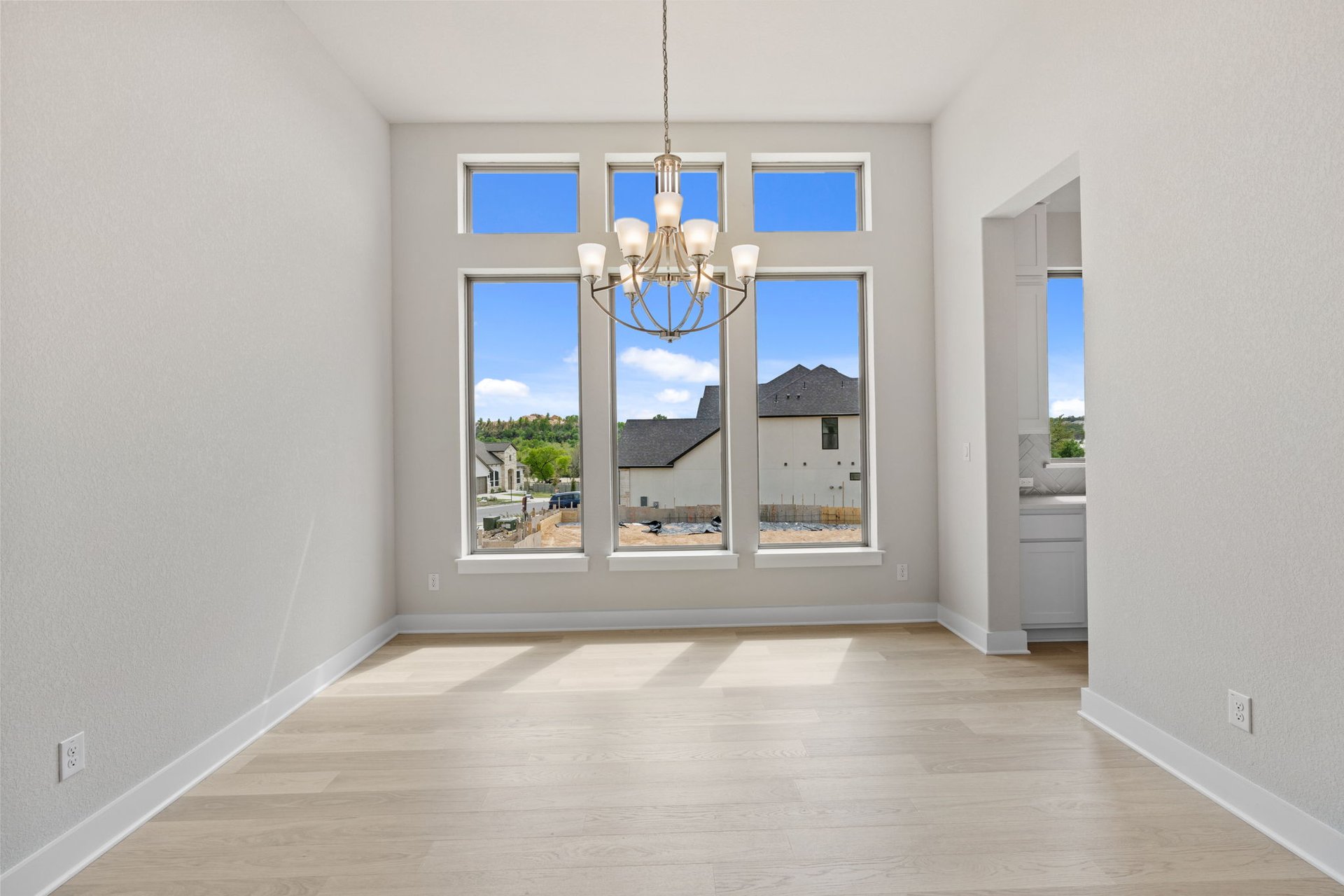1908 Crimson Sunset Drive Georgetown, TX 78628 - Photo 23 of 40 a view of a room with a chandelier fan and windows