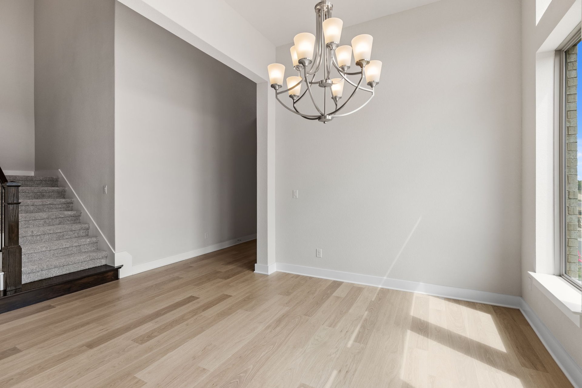 1908 Crimson Sunset Drive Georgetown, TX 78628 - Photo 25 of 40 an empty room with wooden floor and windows