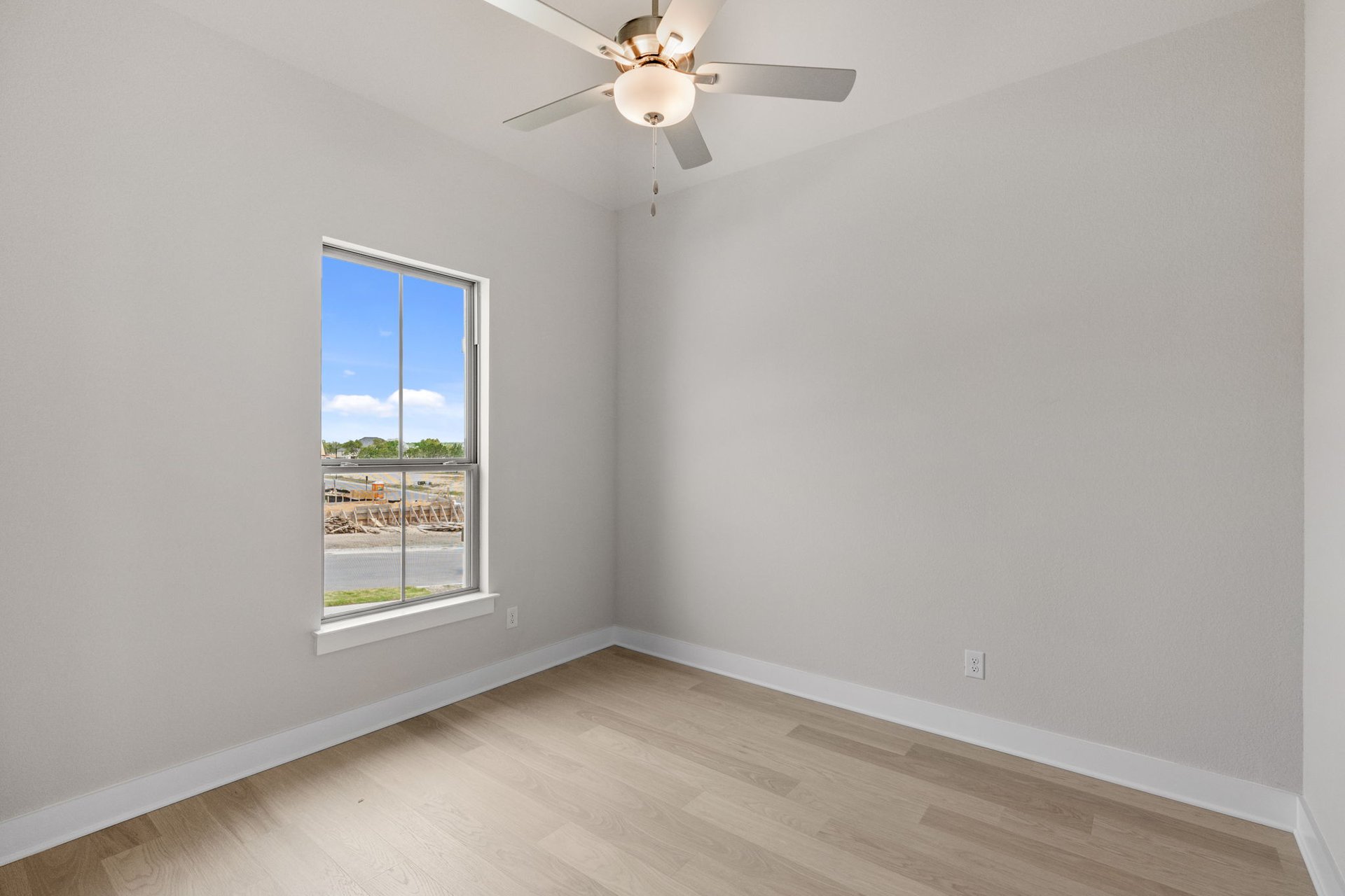 1908 Crimson Sunset Drive Georgetown, TX 78628 - Photo 35 of 40 an empty room with a window and a fan