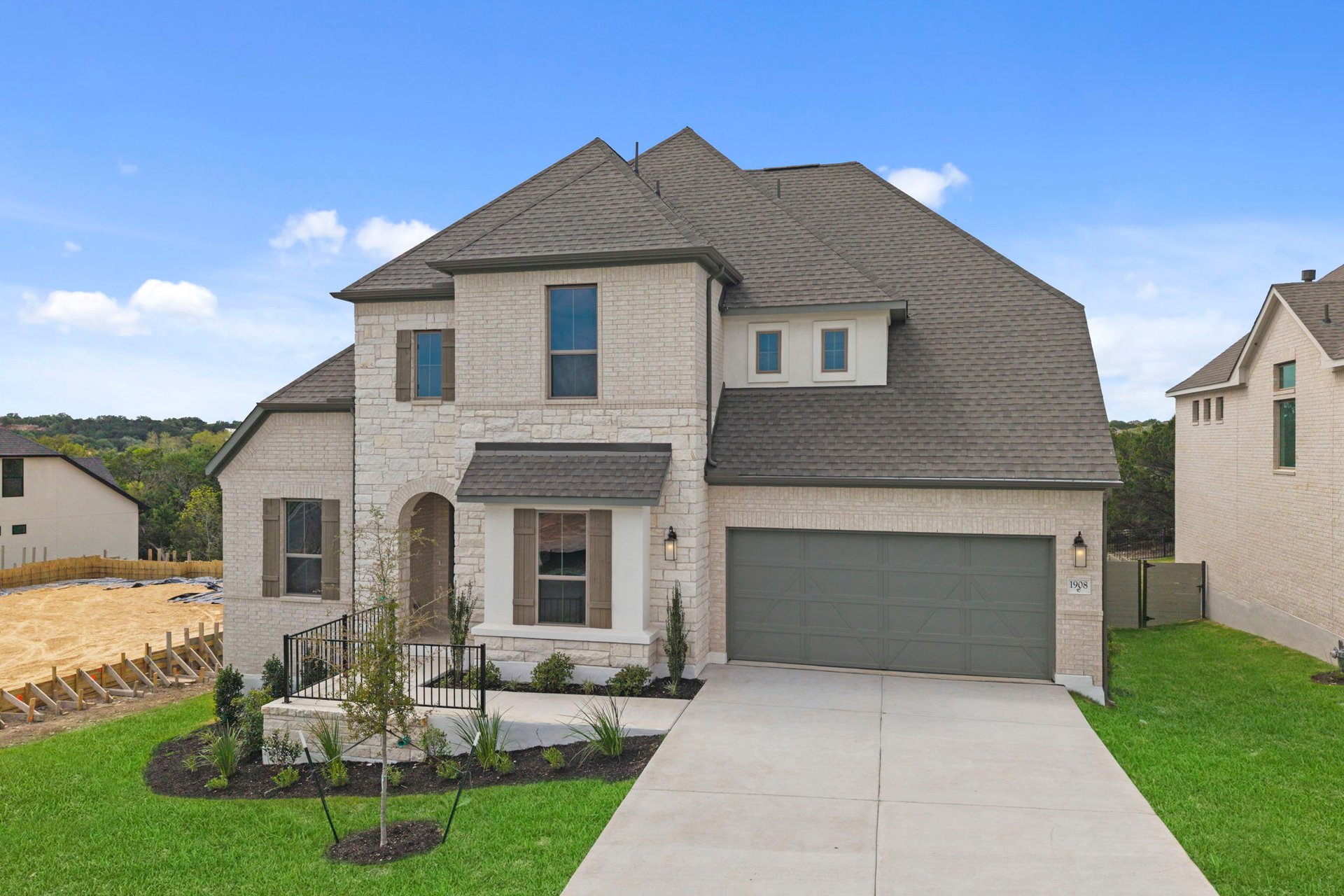 1908 Crimson Sunset Drive Georgetown, TX 78628 - Photo 4 of 40 a front view of a house with a yard