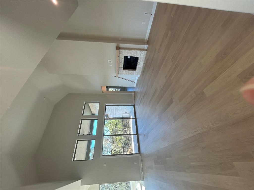 1908 Crimson Sunset Drive Georgetown, TX 78628 - Photo 5 of 22 a view of empty room with wooden floor and fireplace