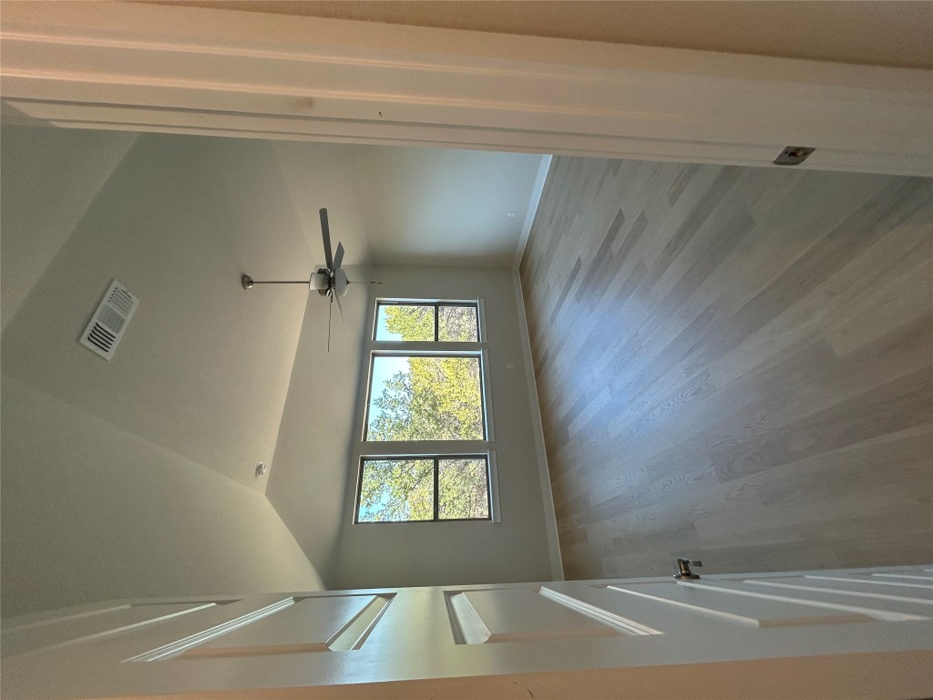1908 Crimson Sunset Drive Georgetown, TX 78628 - Photo 7 of 22 an empty room with wooden floor and windows