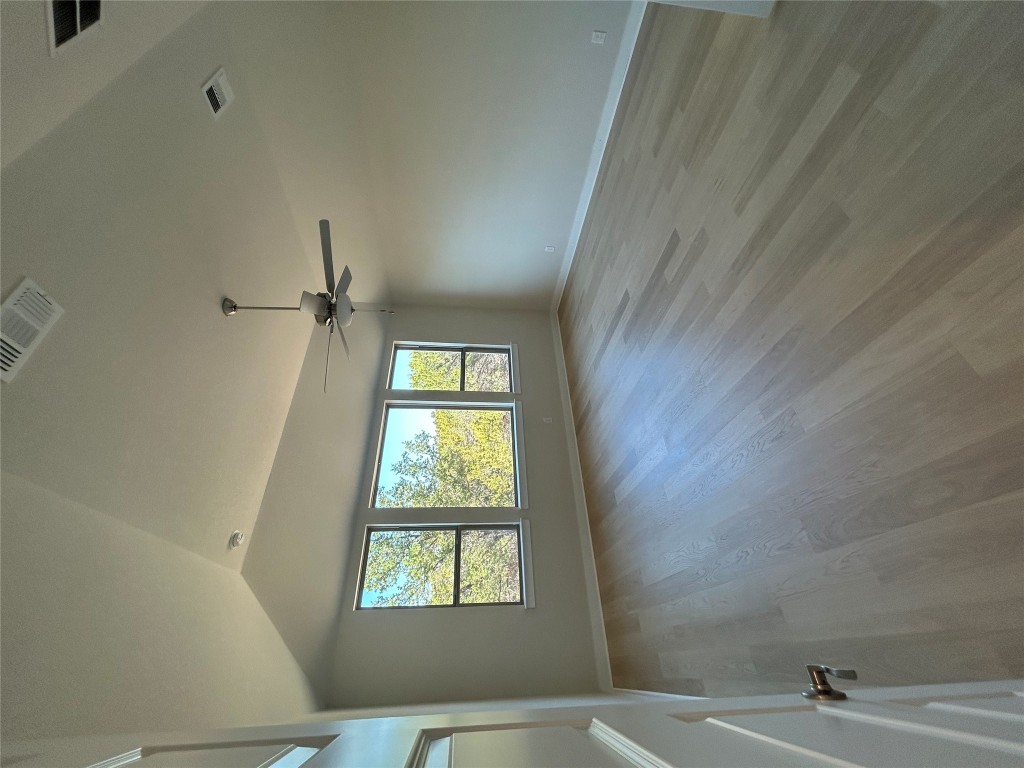 1908 Crimson Sunset Drive Georgetown, TX 78628 - Photo 8 of 22 wooden floor in an empty room with a window