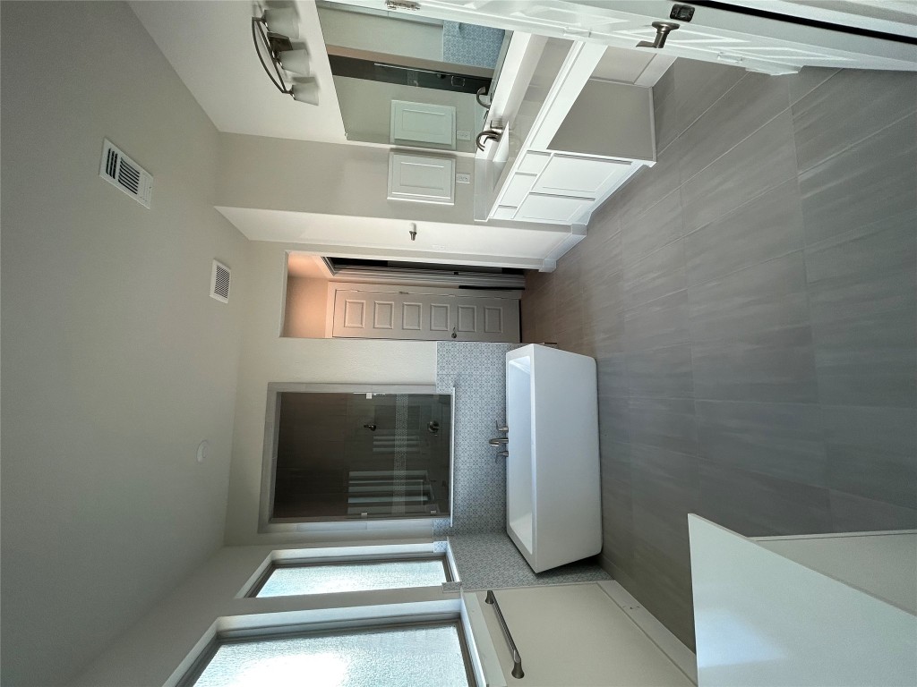 1908 Crimson Sunset Drive Georgetown, TX 78628 - Photo 9 of 22 a bedroom with a bed and large mirror