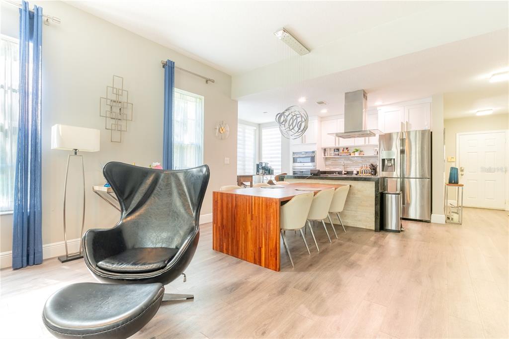 930 Spring Park Street, Unit 103 Kissimmee, FL 34747 - Photo 11 of 40 a living room with stainless steel appliances kitchen island granite countertop furniture and a large window