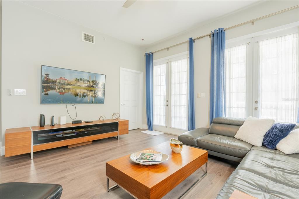 930 Spring Park Street, Unit 103 Kissimmee, FL 34747 - Photo 12 of 40 a living room with furniture and a window