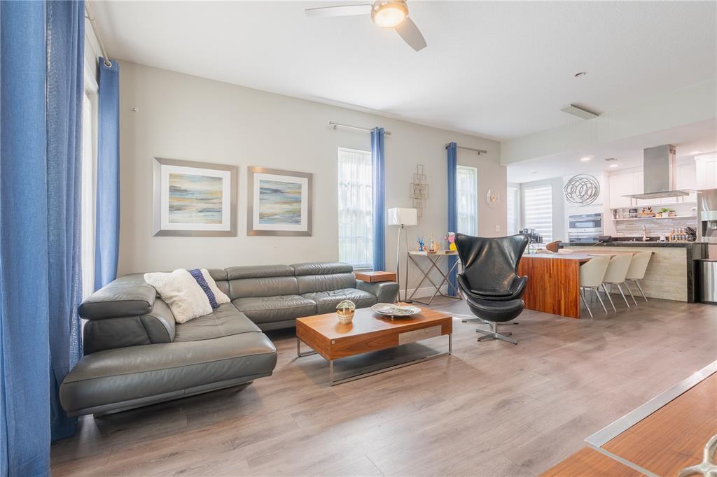 930 Spring Park Street, Unit 103 Kissimmee, FL 34747 - Photo 14 of 40 a living room with furniture kitchen view and a window