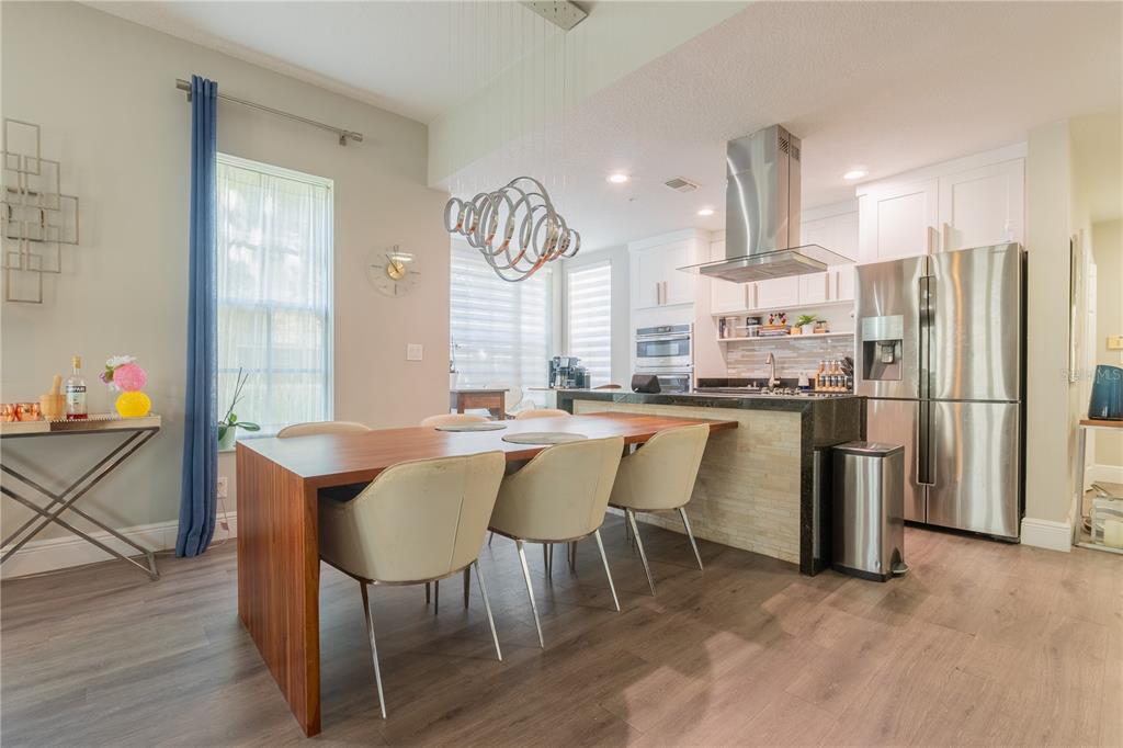 930 Spring Park Street, Unit 103 Kissimmee, FL 34747 - Photo 15 of 40 a dining room with furniture and a kitchen view