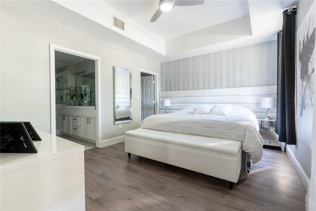 930 Spring Park Street, Unit 103 Kissimmee, FL 34747 - Photo 29 of 40 a bedroom with a bed and a view of bedroom