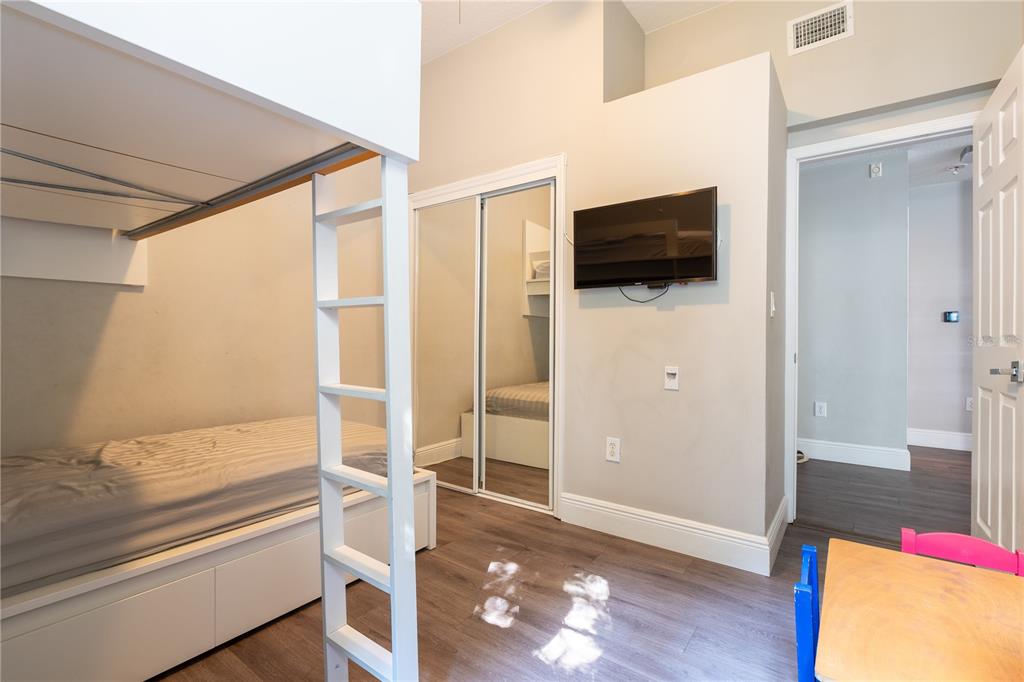 930 Spring Park Street, Unit 103 Kissimmee, FL 34747 - Photo 30 of 40 a living room with furniture and a flat screen tv