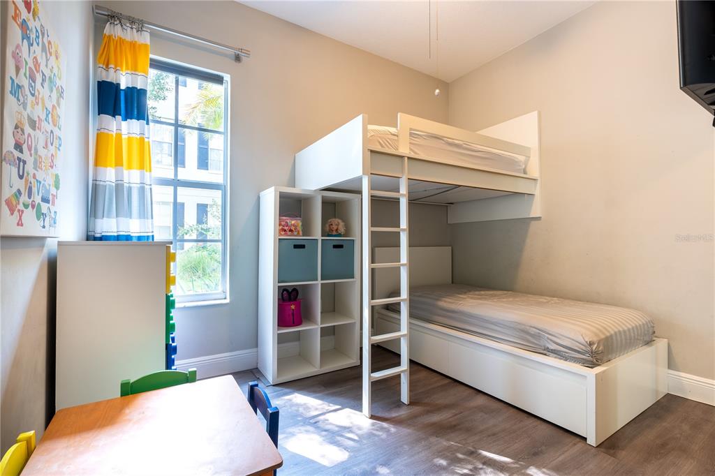 930 Spring Park Street, Unit 103 Kissimmee, FL 34747 - Photo 31 of 40 a bedroom with a bed and a window