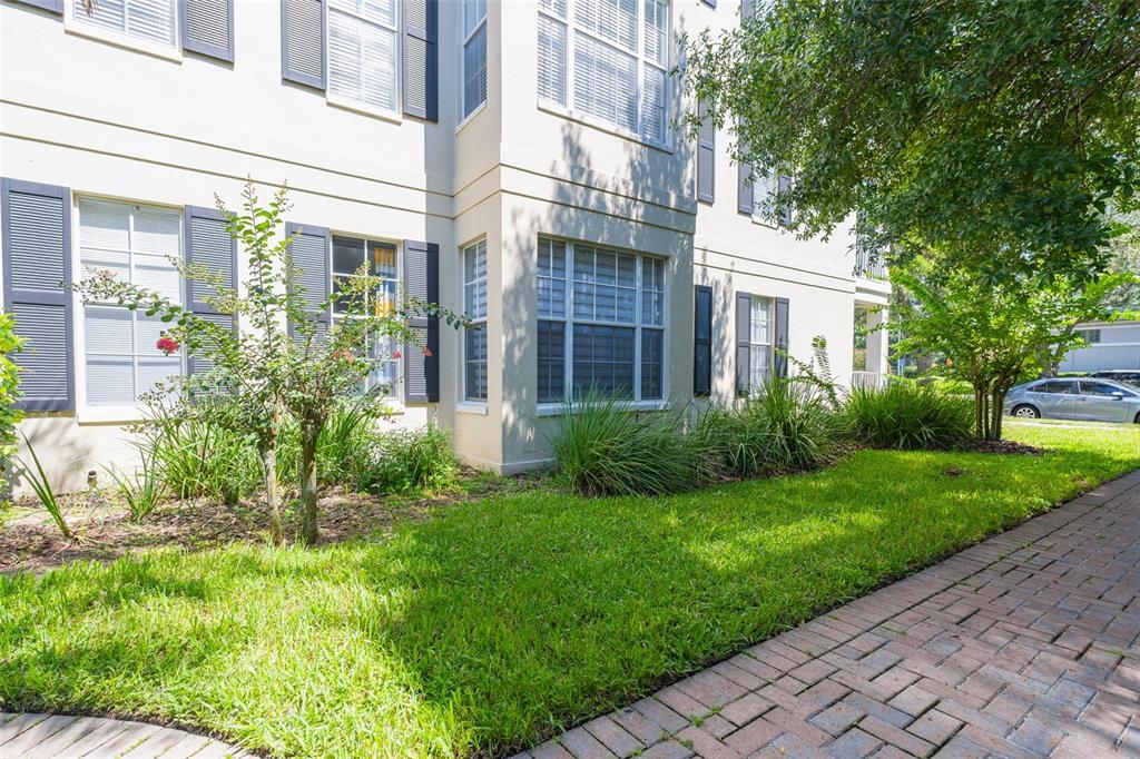 930 Spring Park Street, Unit 103 Kissimmee, FL 34747 - Photo 39 of 40 a view of a building with garden