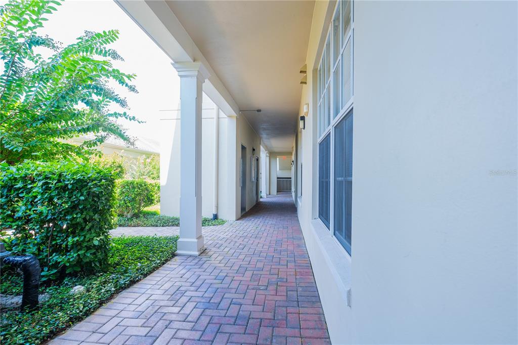 930 Spring Park Street, Unit 103 Kissimmee, FL 34747 - Photo 4 of 40 a view of a pathway both side of house