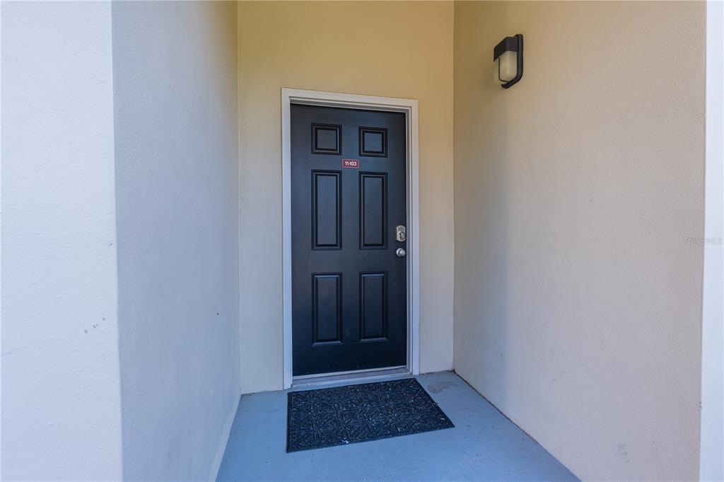 930 Spring Park Street, Unit 103 Kissimmee, FL 34747 - Photo 5 of 40 a view of a hallway with wooden floor