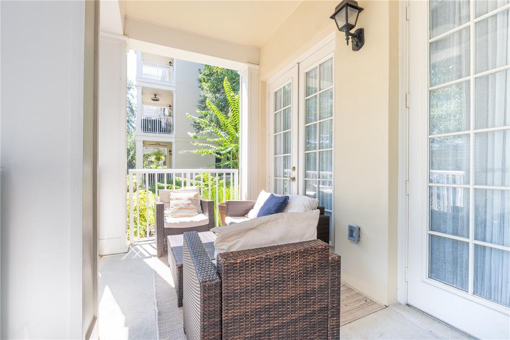 930 Spring Park Street, Unit 103 Kissimmee, FL 34747 - Photo 6 of 40 a living room with furniture and a window
