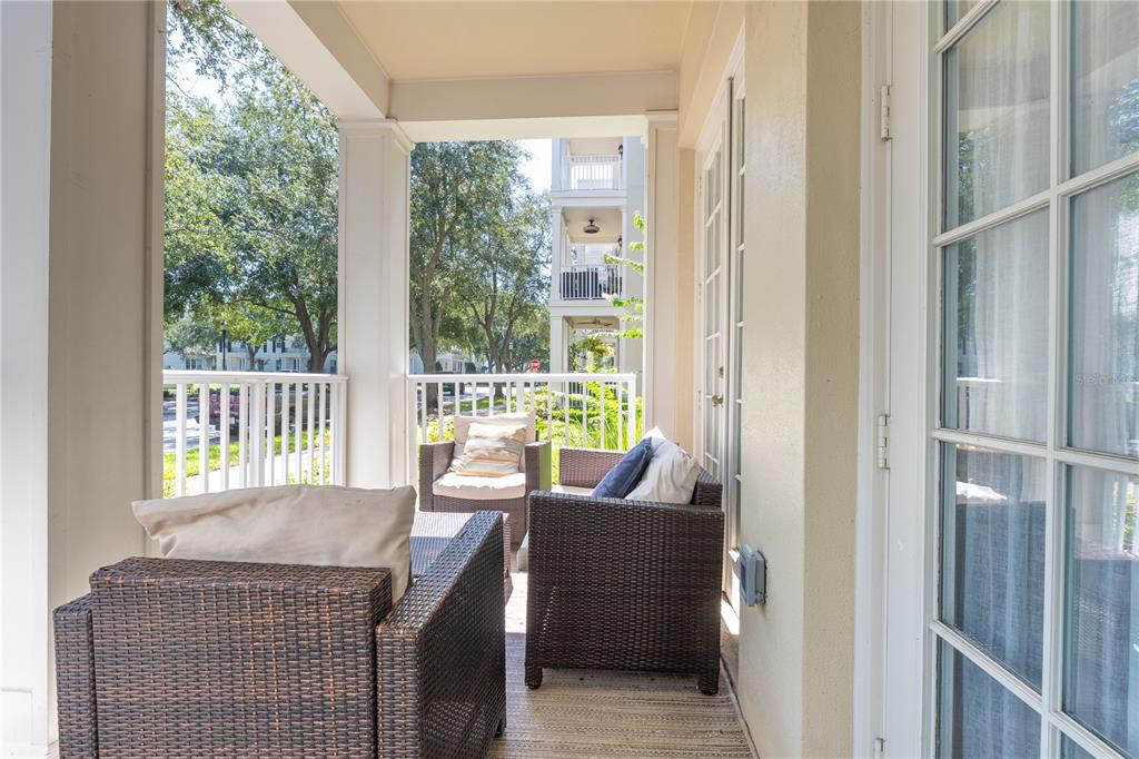 930 Spring Park Street, Unit 103 Kissimmee, FL 34747 - Photo 7 of 40 a dining room with a glass top table and chairs
