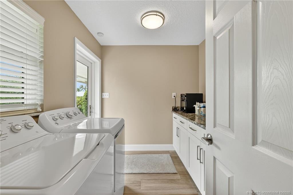 3353 Southeast Fairway East Stuart, FL 34997 - Photo 11 of 55 a kitchen with stainless steel appliances a white table and chair