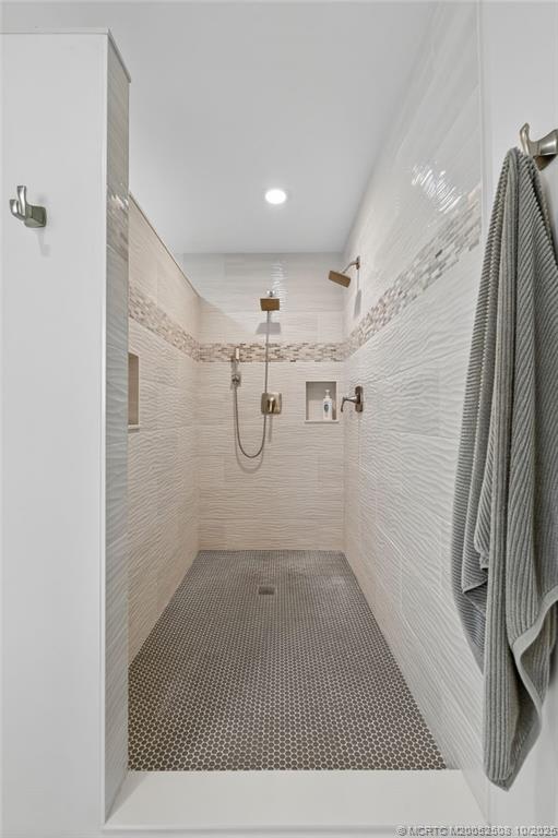 3353 Southeast Fairway East Stuart, FL 34997 - Photo 17 of 55 a bathroom with a shower