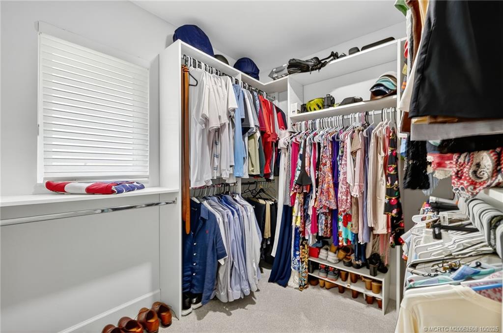3353 Southeast Fairway East Stuart, FL 34997 - Photo 20 of 55 a view of walk in closet with clothes